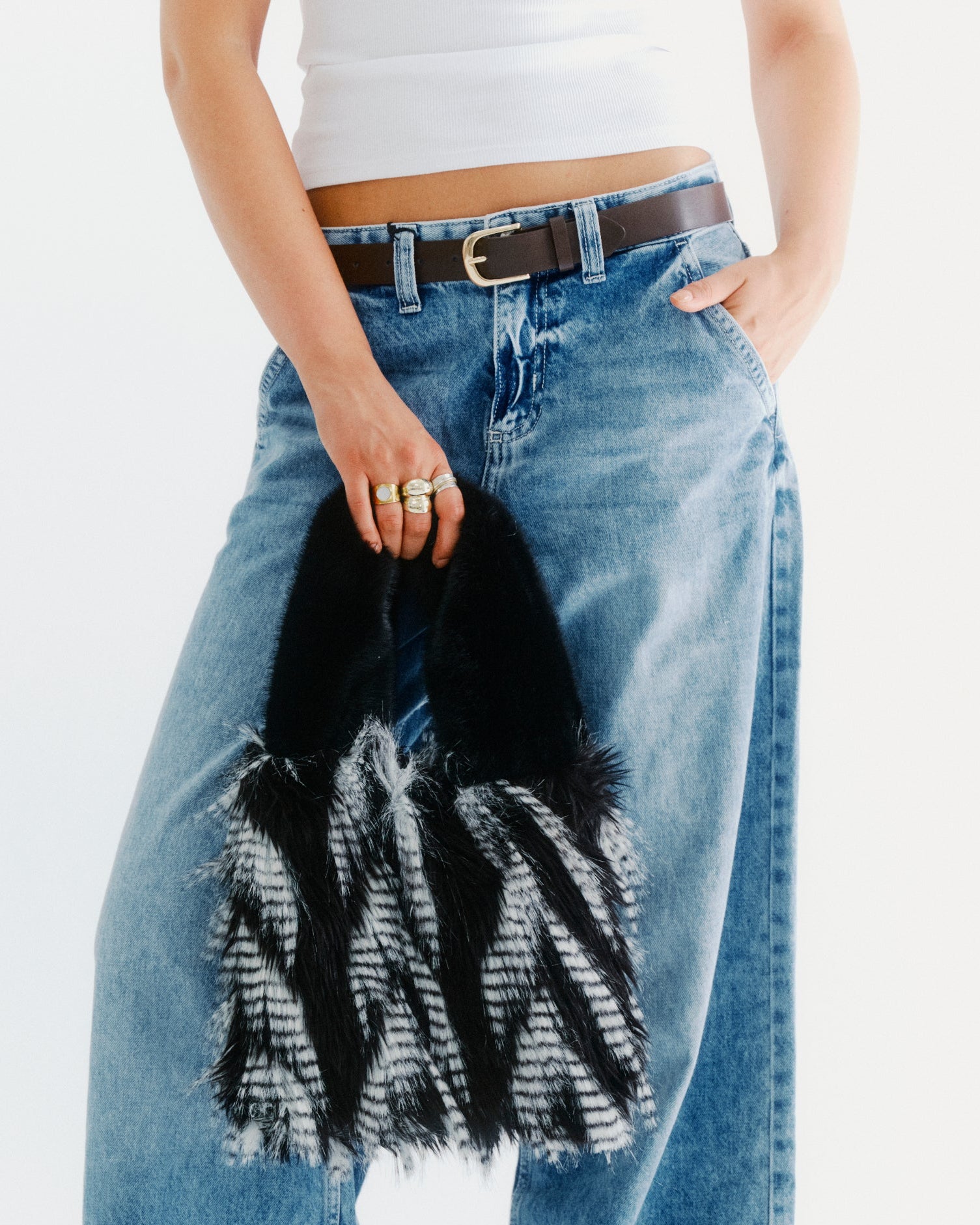 black and white faux fur bag
